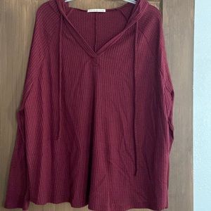 Women’s long sleeve top with hood. Size L.